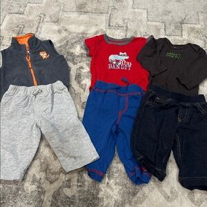 Baby Clothing Set with Red, Blue, and Gray Pieces